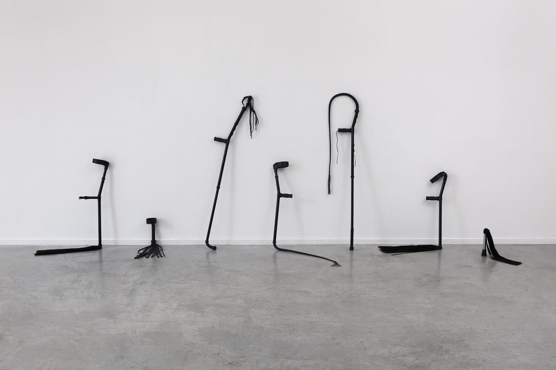 Untitled, 2018, crutches, whips, leather, glue 401x137x83 cm