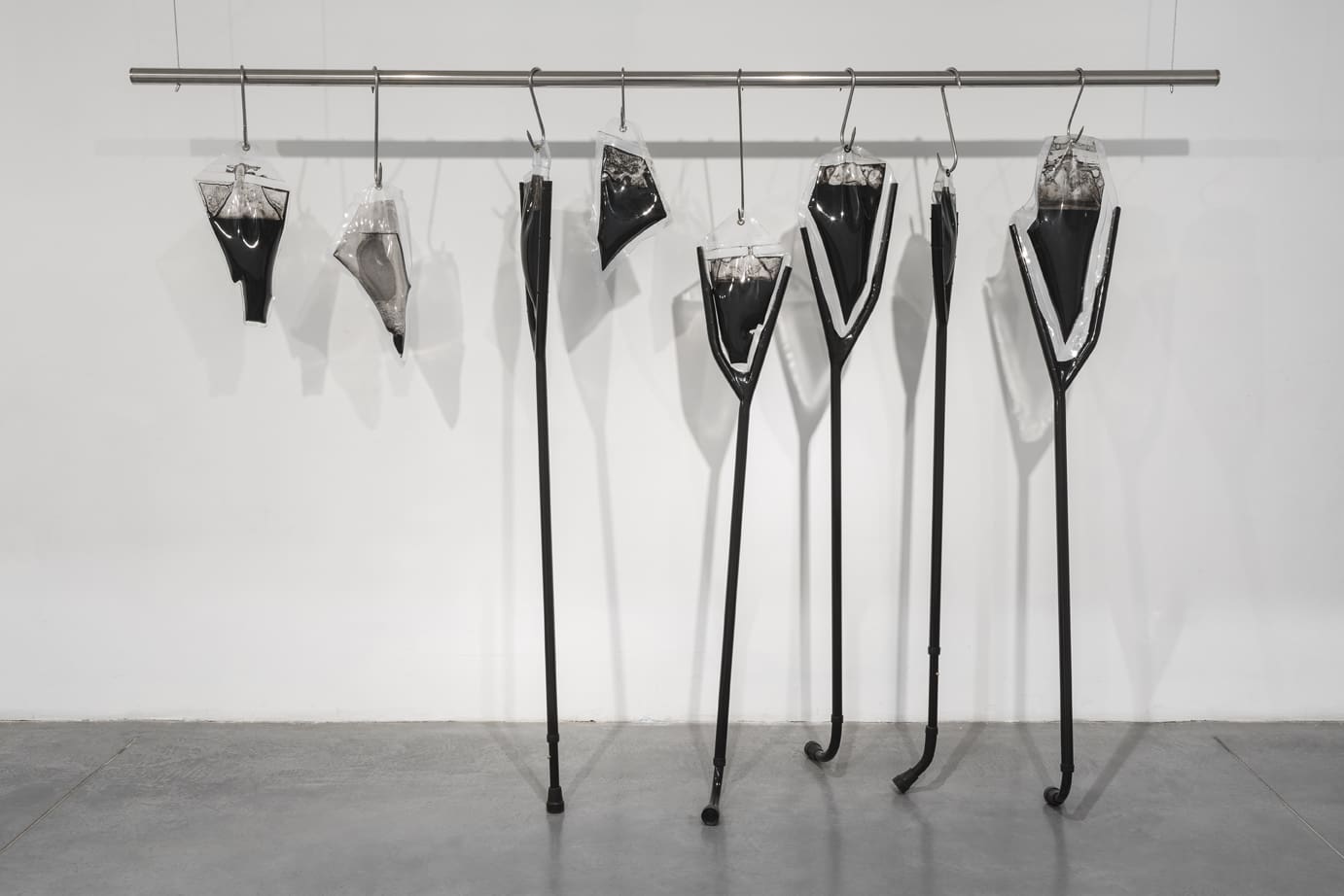 Untitled (from the project: Unreasonable Doubt), 2018, crutches, whips, metals, PVC, ink, water, 250x172x50 cm